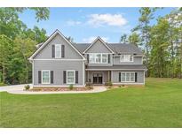 Two story home with gray siding and a large yard at 414 Boulder Crest Trl, Villa Rica, GA 30180