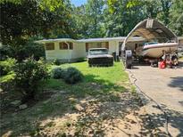House exterior with yard, boat, and truck at 3476 Cooper St, Lithia Springs, GA 30122