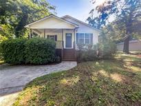 House exterior featuring a front porch and neat lawn at 101 Dodd St, Fairburn, GA 30213