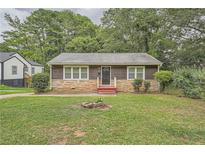 Charming one-story home with stone accents and a well-maintained lawn at 2666 Blount St, Atlanta, GA 30344