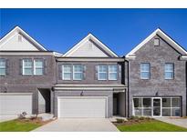 Brick front of townhome with two-car garage at 204 Epping Street # 2, Stockbridge, GA 30281