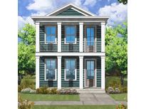 Two-story Craftsman style home with teal siding and white trim at 52 Spirea Way, Auburn, GA 30011