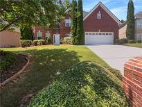 Two story brick house with attached garage at 2669 Saint Paul Sw Dr, Atlanta, GA 30331