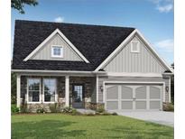 Craftsman style home with gray siding and stone accents at 727 Kestrel Dr, Loganville, GA 30052