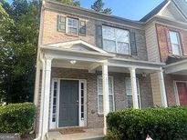 Brick two story townhome with covered porch at 4870 Hairston Park Sq, Stone Mountain, GA 30083