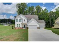 Two-story house with a three-car garage at 2 Lisa Ct, Moreland, GA 30259