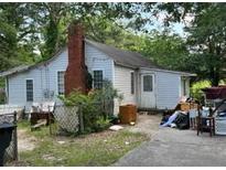 Older home needing repairs, cluttered yard at 126 Irvin St, Jonesboro, GA 30236