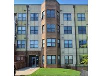 Modern apartment building with brick and light-colored exterior at 898 Oak St # 1127, Atlanta, GA 30310