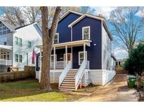 Two story home with white steps and porch at 1587 Alder Se Ct, Atlanta, GA 30317