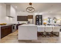 Modern kitchen with island, stainless steel appliances, and dark wood cabinetry at 330 Heatherden Ave, Fayetteville, GA 30214