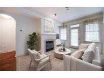 Bright living room with fireplace and access to balcony at 1735 Peachtree Ne St # 321, Atlanta, GA 30309