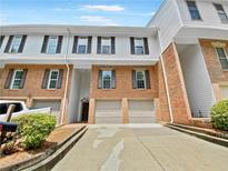 Brick front townhouse with double garage at 502 Brandywine Cir, Atlanta, GA 30350