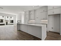 Modern kitchen with island and hardwood floors at 3667 Peachtree Ne Rd # 10, Atlanta, GA 30319