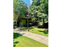 Exterior of building with landscaping and walkway at 307 Lakemoore Ne Dr # D, Atlanta, GA 30342