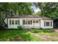 Charming white house with a porch at 153 Hood Cir, Decatur, GA 30030
