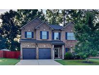 Two-story brick home with a two car garage at 9378 Lantana Trl, Jonesboro, GA 30238