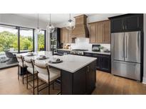 Modern kitchen with large island and stainless steel appliances at 3012 Sunset Pass, Canton, GA 30114