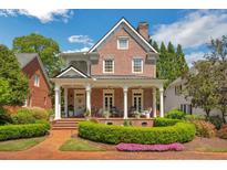 Brick home with front porch and landscaped yard at 161 Blair Valley Ne Dr, Marietta, GA 30060