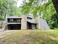Unique stone and stucco home with wooded views at 1809 Silver Ridge Ct, Stone Mountain, GA 30087