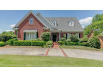 Brick house with landscaping at 265 Regal Dr, Lawrenceville, GA 30046
