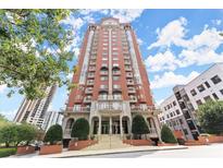 Brick building exterior with grand entrance and landscaping at 3435 Kingsboro Ne Rd # 1201, Atlanta, GA 30326