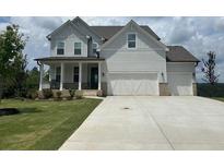 Two story home with white siding, three car garage, and front porch at 37 Ridgeline Nw Way, Cartersville, GA 30121