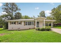 Charming ranch home with a well-maintained lawn at 107 Gladstone Sw Dr, Marietta, GA 30060