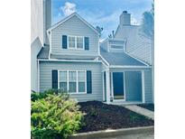 Charming two-story townhome with gray siding and black shutters at 603 Brighton Ct, Norcross, GA 30071