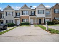 Two-story townhouse with a brick and siding exterior at 2287 Bigwood Trl, Atlanta, GA 30349