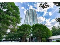 Tall building exterior with lush landscaping and a fountain at 2870 Pharr Court South Nw # 607, Atlanta, GA 30305