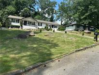 Updated ranch home with landscaped yard and large rocks at 3503 Larkspur Ter, Decatur, GA 30032