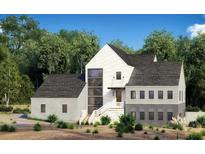 Modern farmhouse exterior with gray and white siding at 235 Winterberry Way, Roswell, GA 30075