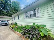 House exterior showcasing landscaping and driveway at 176 Park Place Dr, Lawrenceville, GA 30046