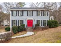 Two-story house with gray siding and red front door at 2990 Mountain Ne Trce, Roswell, GA 30075
