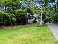 Charming ranch home with carport and landscaped yard at 2606 Ramblewood Ct, Acworth, GA 30102