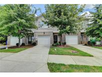 Front view of townhome with two-car garage at 3312 Pennington Dr, Lithonia, GA 30038