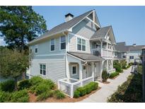 Two story home with gray siding and white trim at 7100 Lunker Lake Dr # 101, Douglasville, GA 30135