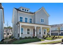 Two-story house with gray siding, white trim, and a front porch at 1936 Stanfield Nw Ave, Atlanta, GA 30318