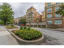 Luxury apartment building with manicured landscaping and convenient parking at 10 Perimeter Summit Ne Blvd # 3412, Brookhaven, GA 30319