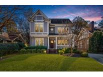 Two-story craftsman home with gray siding and brick accents at 57 Highland Dr, Atlanta, GA 30305