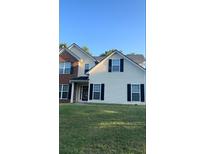 Two-story house with brick and vinyl siding at 635 Beddick Ln, Atlanta, GA 30349