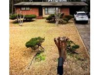Ranch style home with brick exterior and a small front yard at 3430 Longleaf Dr, Decatur, GA 30032