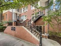 Brick townhouse with stairs and black railings at 745 Fountainhead Ne Ln # 113, Atlanta, GA 30324