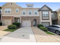 Modern townhome with two-car garage and landscaping at 2314 Rolling Trl, Lithonia, GA 30058