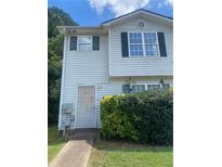 Two-story house with green shutters and a manicured front yard at 7255 Crestside Dr, Austell, GA 30168