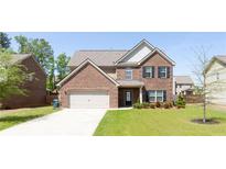 Two story brick home with attached garage at 1505 Clubhouse Ct, Mcdonough, GA 30252