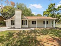 Newly renovated ranch home with a covered porch at 4221 Inverness Rd, Duluth, GA 30096