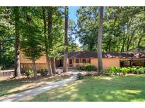 Ranch style home with a covered porch and stone accents at 466 Raven Springs Trl, Stone Mountain, GA 30087