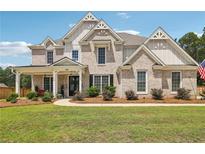 Two story home with brick and siding exterior at 41 Foxcroft Way, Villa Rica, GA 30180