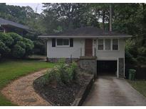 Charming ranch home with attached garage and landscaped yard at 2121 Arlington Ne Ave, Atlanta, GA 30324